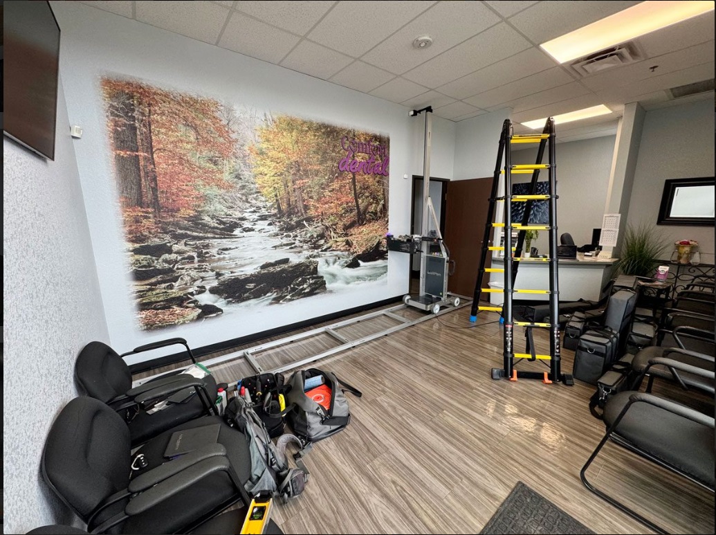Autumn forest stream mural in a dental waiting room with printing equipment