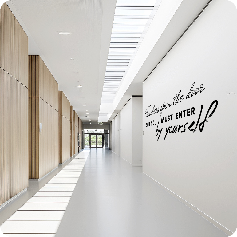 Inspirational typography mural on a bright school hallway wall
